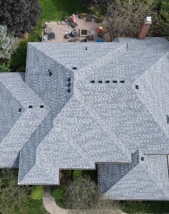 aerial-new-roof top view of a new roof with grey shingles