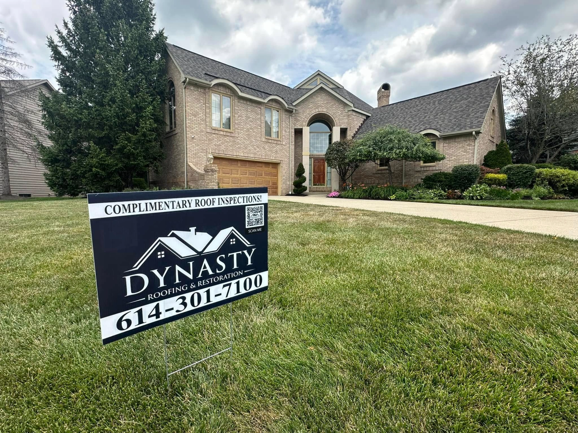 dynasty-roofing-new-roof roof yard sign in front of home