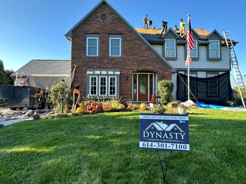 dynasty-roofing-replacement dynasty roofing yard sign in front of a roofing job