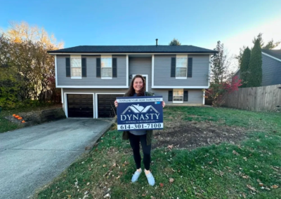 a columbus homeowner in front of their house with new roof