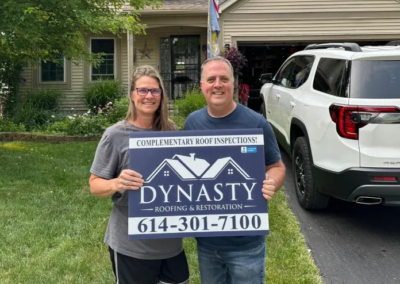 happy gahanna homeowner in front of their home with new siding