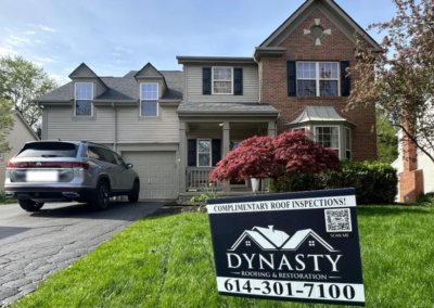 a columbus homeowner in front of their house with new siding